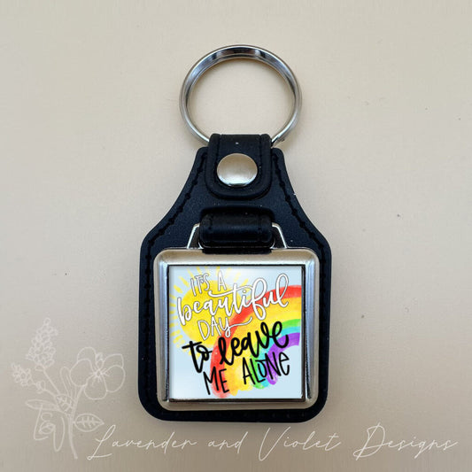 LEAVE ME ALONE VINYL KEYCHAIN SQUARE