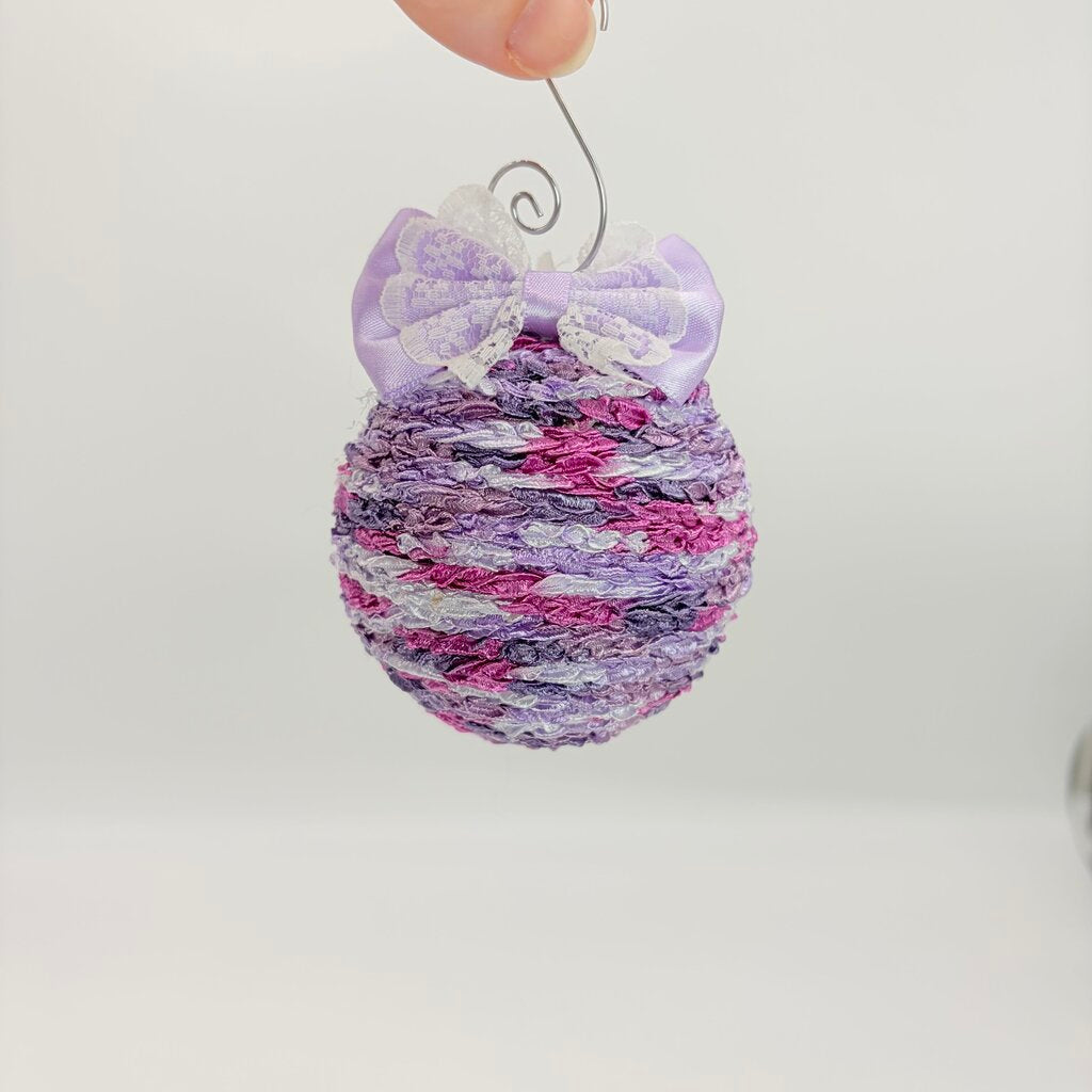 Purple variegated shatterproof ornament w/bow