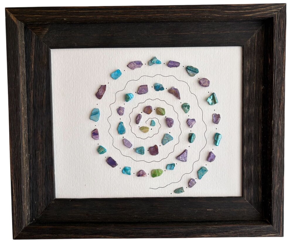 Spiral design on dark wood