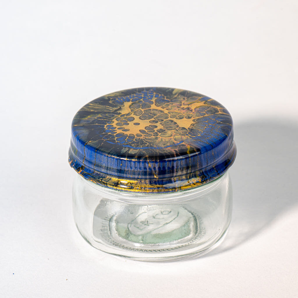 4 oz Jar Cover is gold black blue