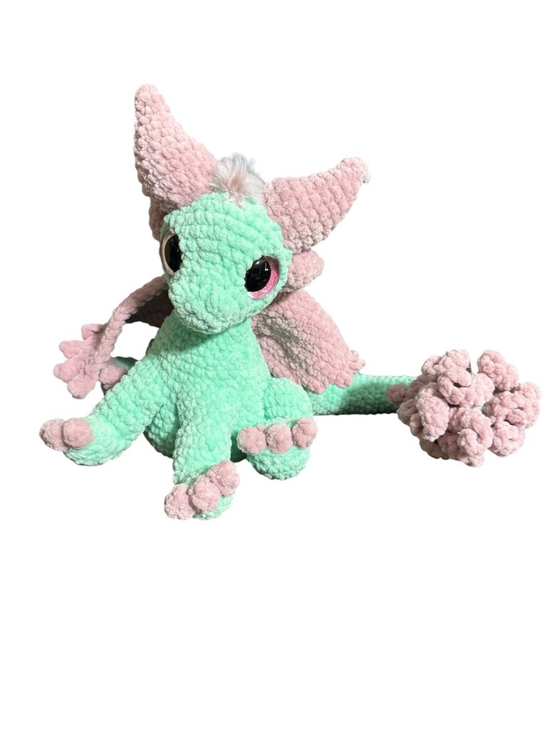 Crocheted feather tail dragon sitting