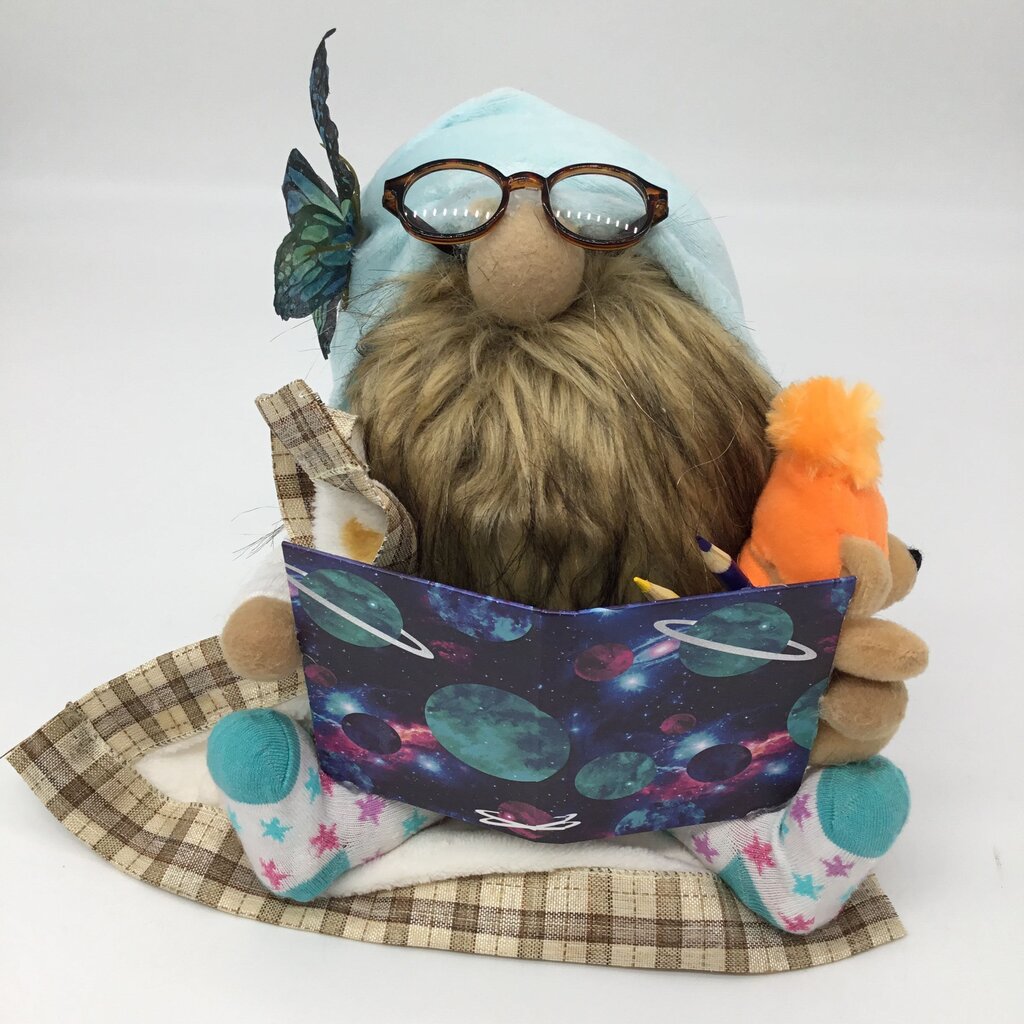 Reading Gnome holding blanket and teddy bear