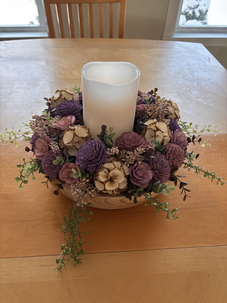 Large Wooden Bowl filled with Purple, Cream and Brown Sola Wood Flowers and Center Candle