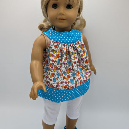 Easter tunic with blue neckline and hem crocs and capri leggings