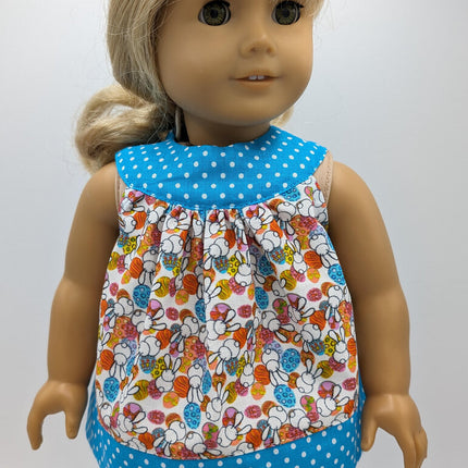 Easter tunic with blue neckline and hem crocs and capri leggings