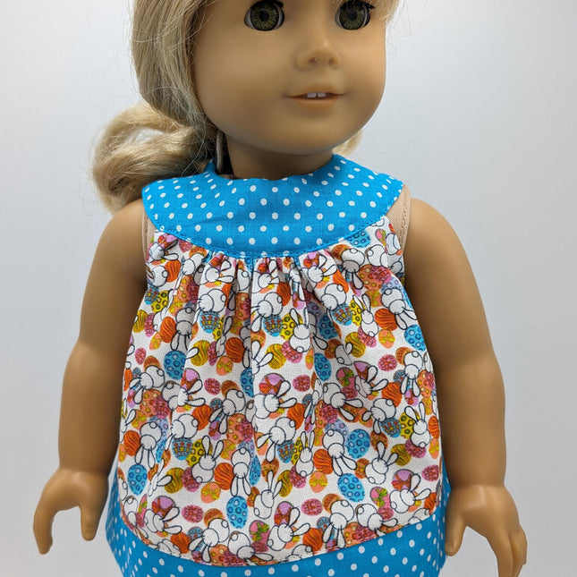 Easter tunic with blue neckline and hem crocs and capri leggings