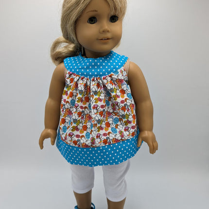 Easter tunic with blue neckline and hem crocs and capri leggings