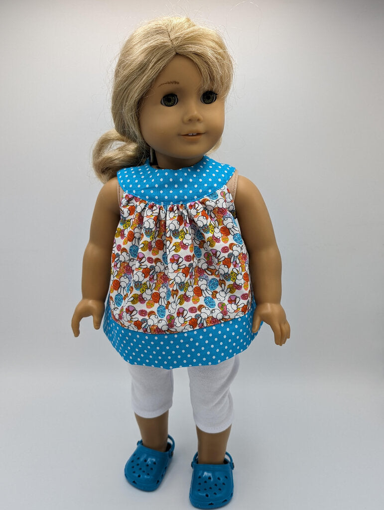 Easter tunic with blue neckline and hem crocs and capri leggings