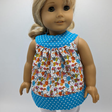 Easter tunic with blue neckline and hem crocs and capri leggings