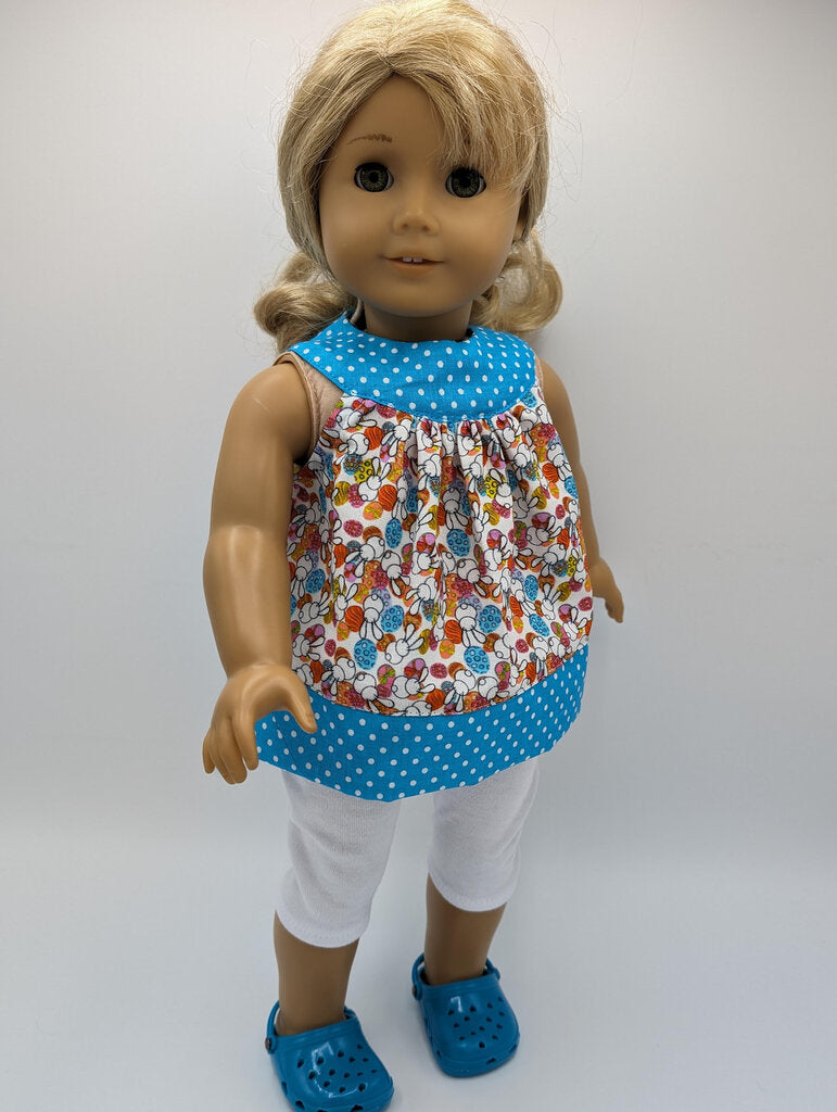 Easter tunic with blue neckline and hem crocs and capri leggings