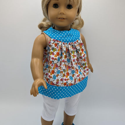 Easter tunic with blue neckline and hem crocs and capri leggings