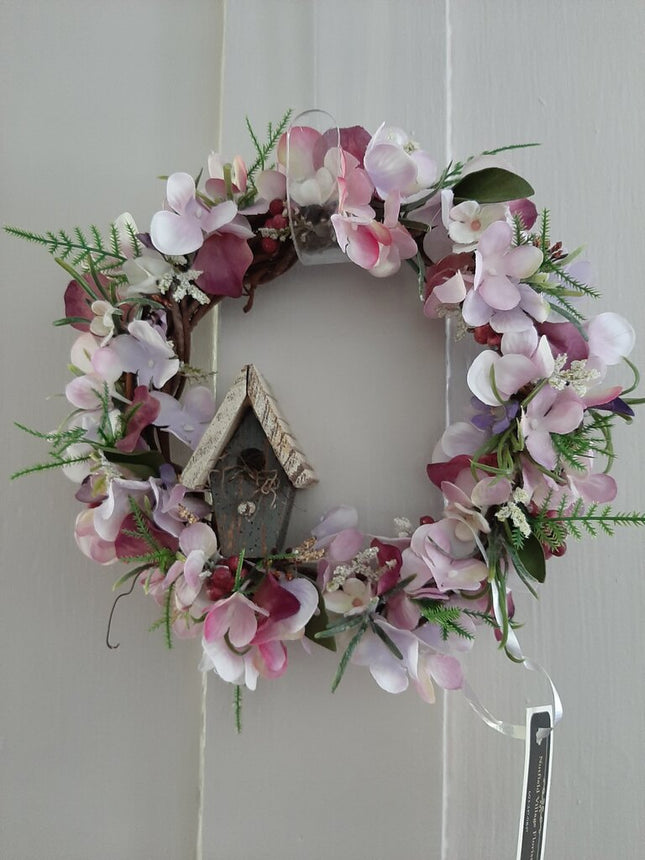 548- pink wreath with bird house