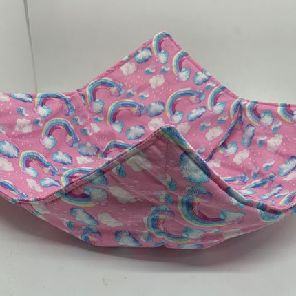 DC pink with rainbows and clouds