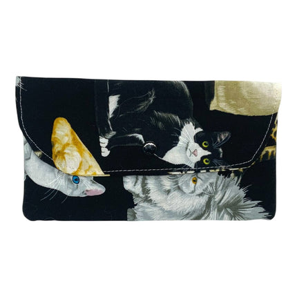 med purse, cats on black