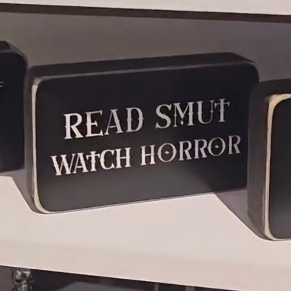 Read smut watch horror box sign