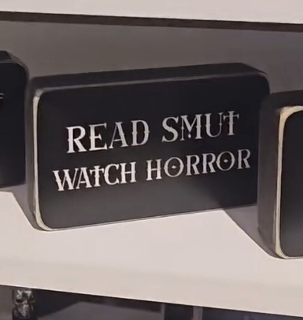 Read smut watch horror box sign