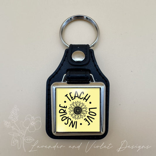 TEACH LOVE INSPIRE VINYL KEYCHAIN SQUARE