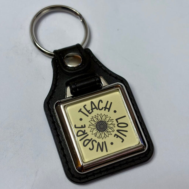 TEACH LOVE INSPIRE VINYL KEYCHAIN SQUARE