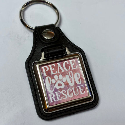 PEACE LOVE RESCUE VINYL KEYCHAIN SQUARE