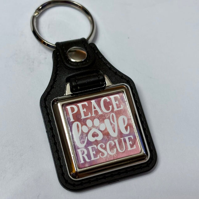 PEACE LOVE RESCUE VINYL KEYCHAIN SQUARE