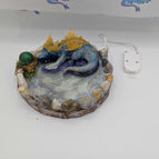 blue/teal/gold with green egg baby