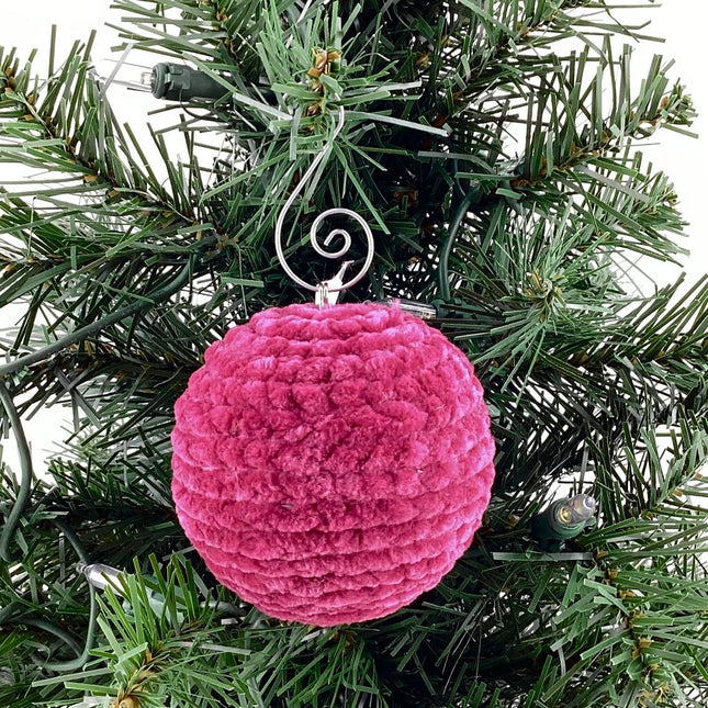 Shatterproof ornament crocheted dark magenta