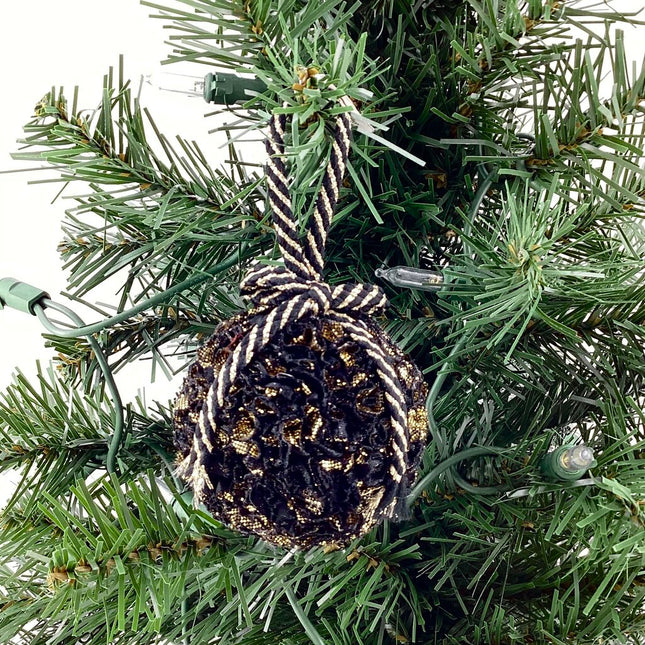 Shatterproof ornament black and gold fabric