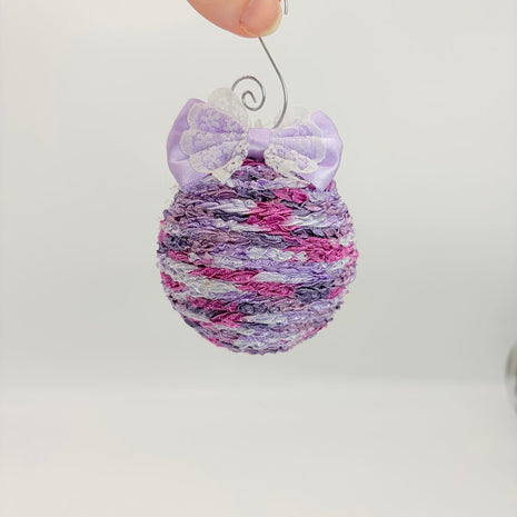 Purple variegated shatterproof ornament w/bow