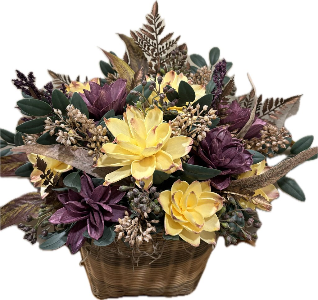 Basket with giant dahlias in yellow and purple