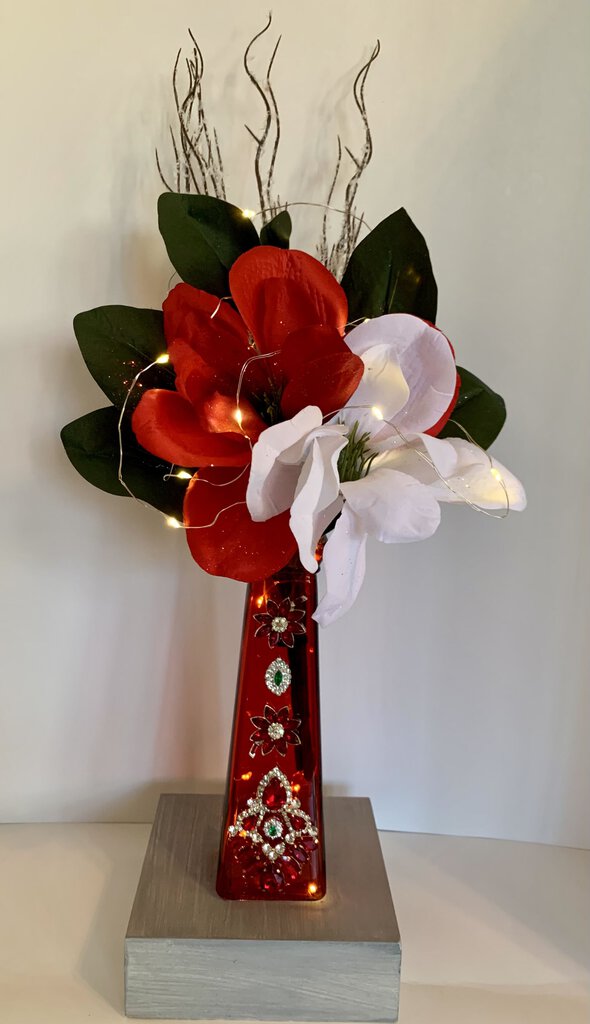 VTG RED VASE decorated w/ vtg Christmas color jewelry. Added Christmas flowers & fairy lights