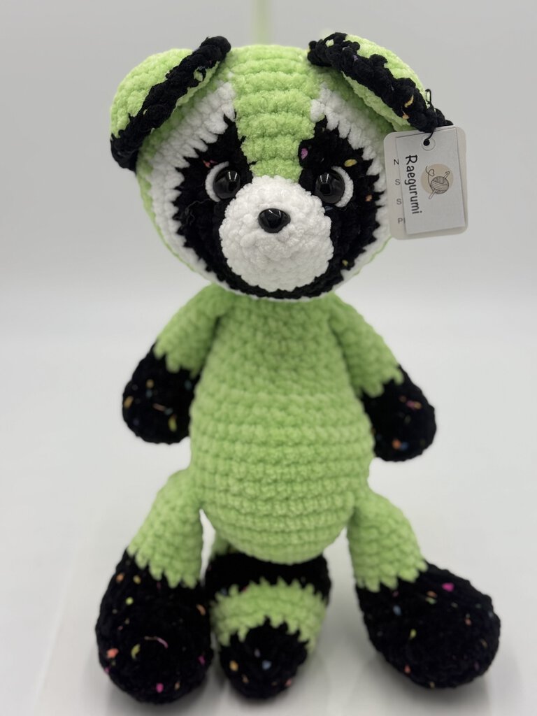 Crocheted neon green raccoon