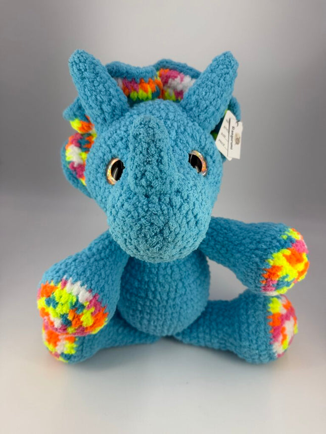 Crocheted triceratops plushie