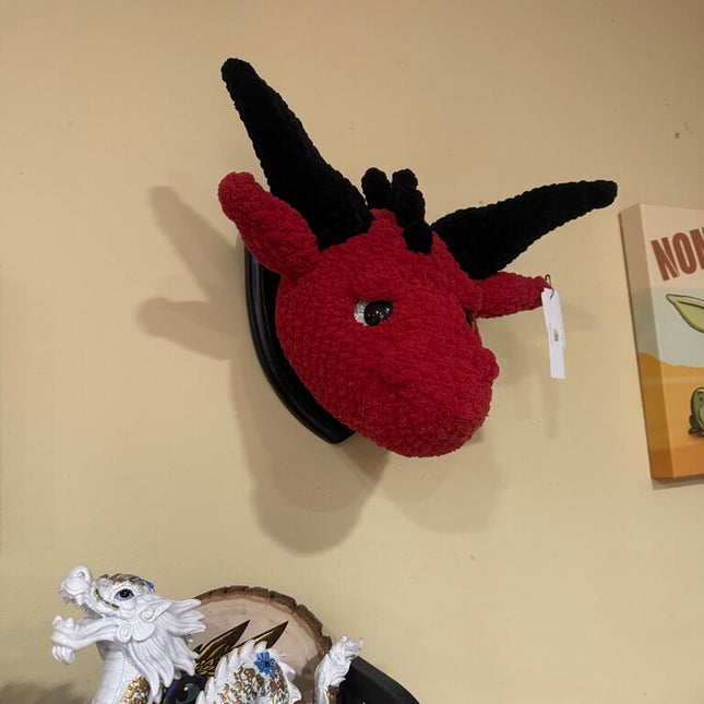 Crocheted dragon head plaque