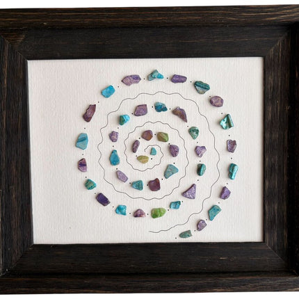 Spiral design on dark wood