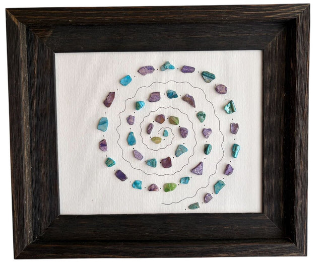 Spiral design on dark wood