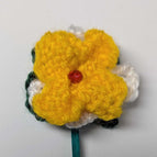 forest green leaves with white and yellow petals and a red beaded center