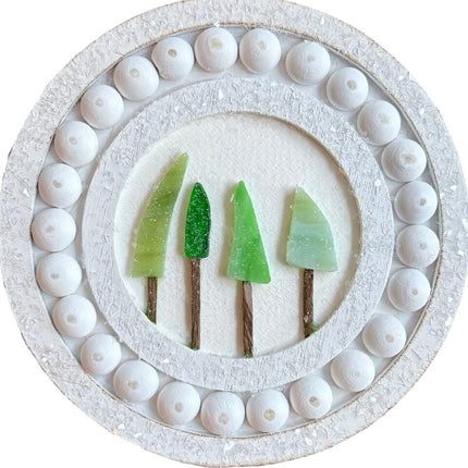 4 small glass trees on round frame