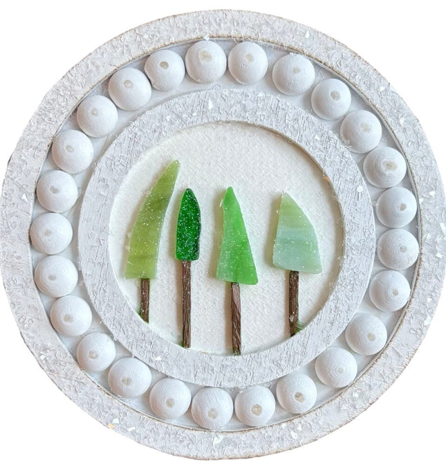 4 small glass trees on round frame