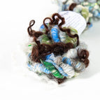 icy blues, deep greens, and soft grays