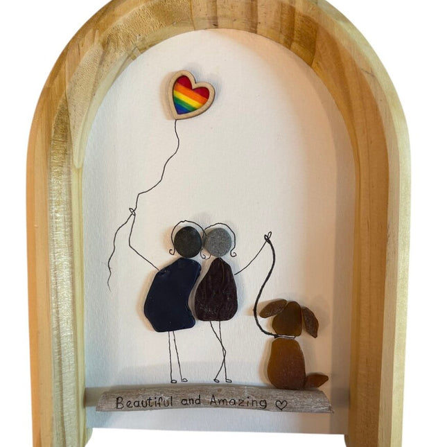 Pride piece with rainbow heart balloon and dog