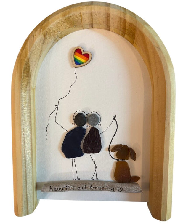Pride piece with rainbow heart balloon and dog
