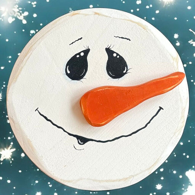 hand painted wood snowman, smiling, nose to right