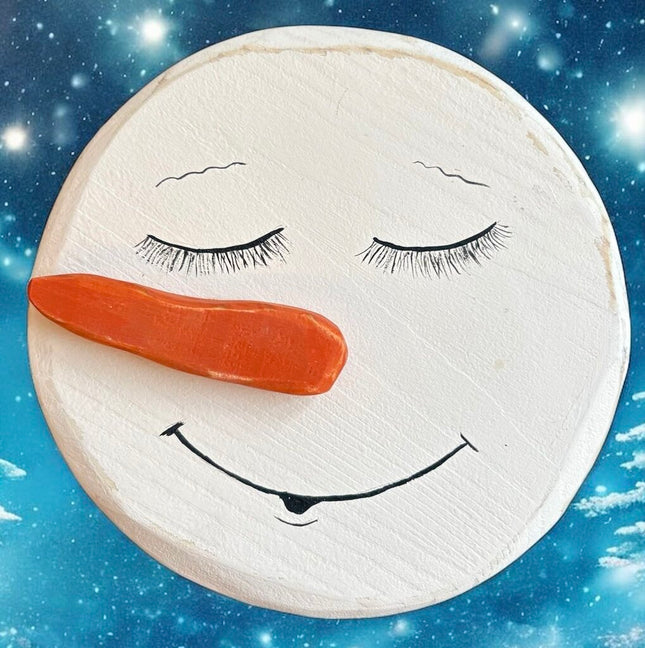 hand painted wood snowman, closed eyes, nose to left