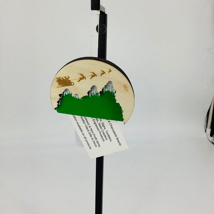 Ornament sleigh over the trees