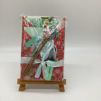 Red paper with teal flowers