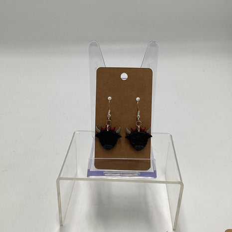 black highland cow orange bow