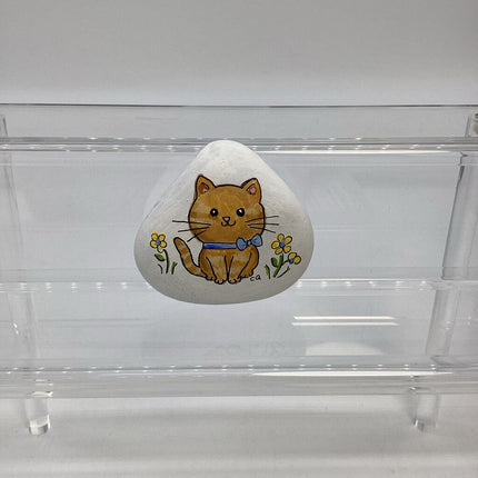 Rock white w/yellow cat