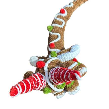 Crocheted gingerbread dragon plushie