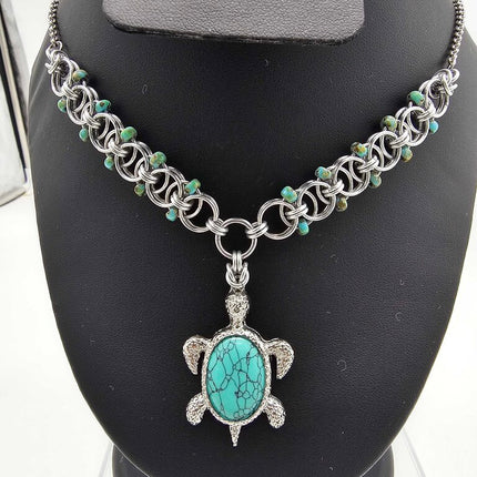 Dyed Turquoise Turtle with Silver Beaded Helm Weave Necklace 16 inches