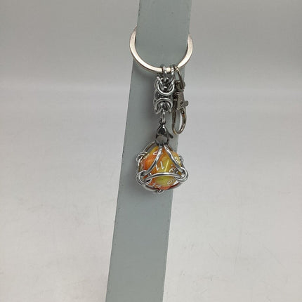 Caged D20 Keychain - Yellow Orange Marble D20, Silver Byzantine